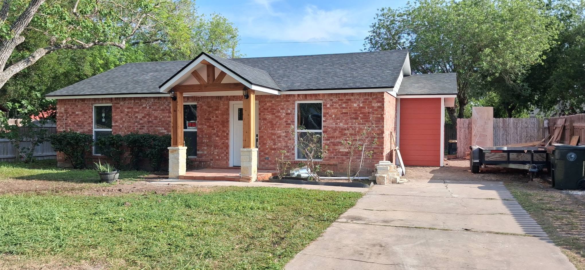 Newly built brick home with cedar columns